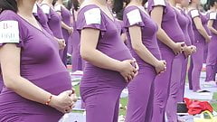 Pregnant Asian women doing yoga (non porn)
